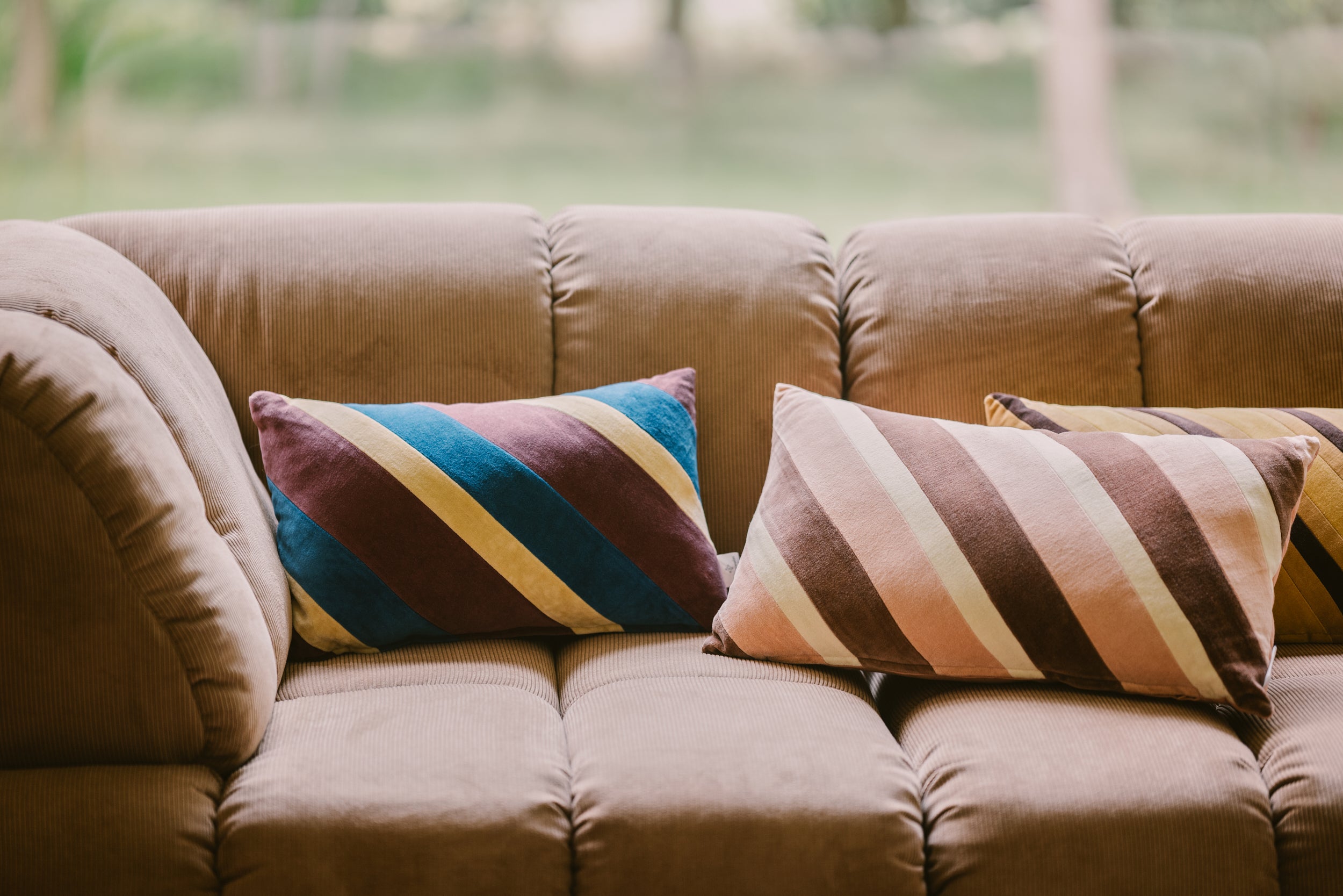 Striped velvet cushion